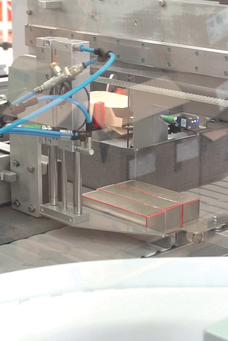 Side load case packer inside cartons